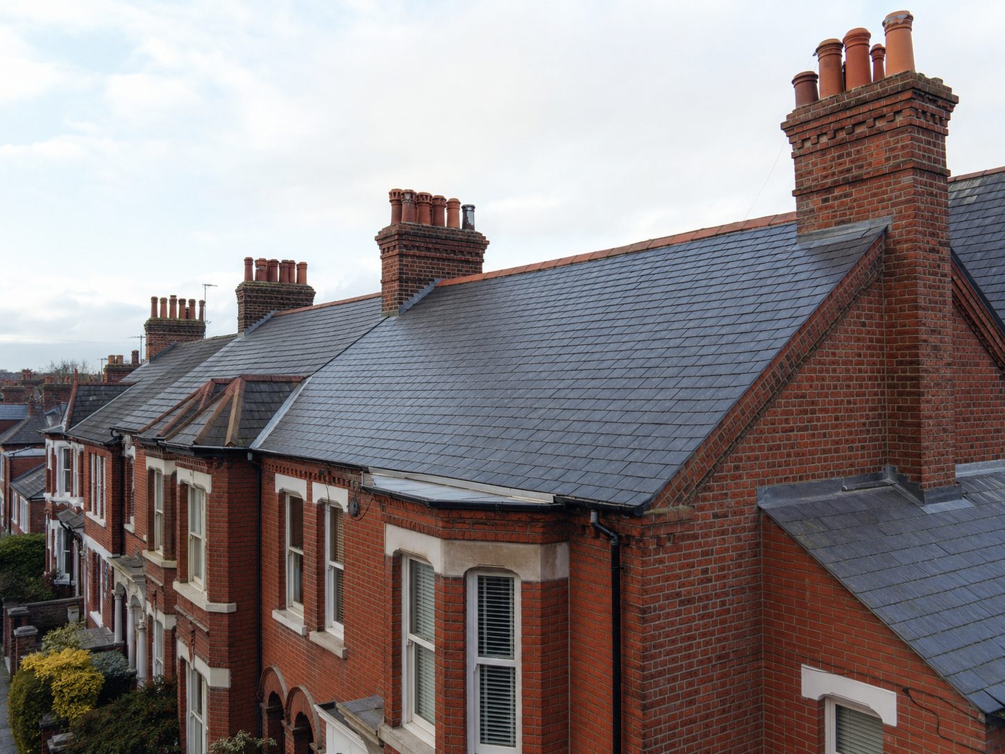 site photograph of natural slate covering re-laid on a period historic town roof near Eye, Suffolk off the A140 — general roofing across Mid Suffolk District Council